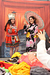 Tourists try on traditional clothing from around the world at a program held in Gwanghwamun Square on Tuesday as part of this year's Cultural Diversity Week. [YONHAP]
