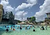 Visitors swim in an outdoor pool at Shinhwa Water Park in Seogwipo, Jeju Island, on Thursday, which was Children's Day. [YONHAP]