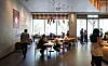 Customers return to a coffee shop chain in downtown Seoul on Monday, the first day after the so-called Level 2.5 social distancing measures were lifted for the greater Seoul area. [NEWS1]