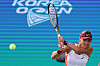 Emma Raducanu returns the ball during a round of 16 game against Yanina Wickmayer of Belgium at the Hana Bank Korea Open at Olympic Park Tennis Center in Songpa District, southern Seoul on Thursday.  [YONHAP]
