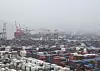 Fog shrouds over containers stacked at a port in Busan on June 1. [YONHAP]
