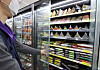 A door was installed on the open-refrigerated section of a convenience store in eastern Seoul on Tuesday. The store said it saved up to 63 percent in daily electricity fees compared to the same period a year earlier after installing the door last month. The government announced an increase in electricity rates for consumer and industrial use by 8 won ($0.01) per kilowatt hour for the second quarter on Monday.