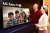Two models pose for the camera to promote LG Electronics' new television lineup, marketed as LG Easy TV, that targets older consumers. [LG ELECTRONICS]