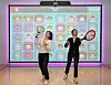 Models play virtual tennis on the Spark S1, a smart health care system developed by Happy Sketch, at its launch event in Gangnam, southern Seoul, Wednesday. Happy Sketch developed an all-in-one screen module where users can play different sports with characters from the animation “Puka.” [YONHAP]