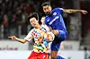 FSV Mainz' Lee Jae-sung, left, and Leverkusen's Kerem Demirbay fight for the ball during a Bundesliga match between in Mainz, western Germany on Feb.18. [AFP/YONHAP]