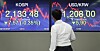 An employee stands in front of the screen with the final Kospi at the dealing room in Hana Bank, in Jung-district, central Seoul, Thursday. [YONHAP]