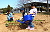 Suwon citizens Lee Chan-woo, his wife Shin Hyun-sun and their daughter plant and water crops at the Suwon Tap-dong Citizen's Farm during its opening weekend in mid-March. [KIM JU-YEON]