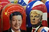Traditional Russian wooden dolls called Matryoshka depicting China's President Xi Jinping, left, and U.S. President Donald Trump are on sale at a souvenir shop in St. Petersburg, Russia, on Nov. 21, 2024. [AP/YONHAP]