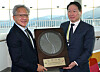 Nvidia CEO Jensen Huang receives an SK hynix HBM4 semiconductor wafer as a gift from SK Group Chairman and Korea Chamber of Commerce and Industry Chairman Chey Tae-won at the APEC CEO Summit held at the Gyeongju Arts Center in Gyeongju, North Gyeongsang, on Oct. 31. [JOINT PRESS CORPS]