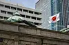 Japan's flag flutters in the wind on the Bank of Japan head office building in Tokyo on May 1. [AFP/YONHAP]