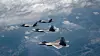 South Korean F-35A and U.S. F-22 fighters take part in a joint combat drill in an apparent show of force against North Korean military threats in a photo provide by the U.S. Air Force Thursday. The exercise took place over a central region in South Korea, conducting attack and defense missions. It marked the first exercise of its kind between the two sides’ advanced aircraft. [YONHAP]