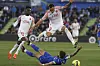Mallorca defender Franco Russo leaps over Getafe striker Cristian Portu during a La Liga match between Getafe and RCD Mallorca at Coliseum Alfonso Perez stadium in Getafe, Spain on Friday. [EPA/YONHAP]