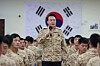 President Yoon Suk Yeol, center, speaks to the South Korean Army’s Akh unit in the United Arab Emirates on Sunday. [PRESIDENTIAL OFFICE]