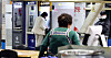 A customer uses an ATM installed in front of a diner in Seoul on Feb. 16. [YONHAP]