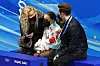 Coach Eteri Tutberidze, left, reacts with Kamila Valieva of the Russian Olympic Committee, center, and coach Daniil Gleikhengauz after Valieva's free skate performance at the Capital Indoor Stadium in Beijing on Feb. 17. [REUTERS/YONHAP]