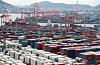 Containers are stacked up at a port in Busan on September 13. [YONHAP]