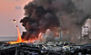 A helicopter puts out a fire at the scene of an explosion at the port of Lebanon's capital Beirut on Tuesday. [AFP/YONHAP]