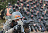 A soldier aims a gun during training at the Army training center in Nonsan, South Chungcheong, on Thursday. [NEWS1]
