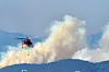 A Korea Forest Service helicopter puts out a wildfire on a mountain in Yeongdeok County in North Gyeongsang on Wednesday. The flames were thought to be extinguished the previous day but reignited overnight, leading to the evacuation of some 190 households nearby. The agency issued a Level 3 wildfire warning, the second highest in the four-tier system, and 36 helicopters and 600 personnel were dispatched to the scene. [NEWS1]