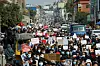 In this file photo, people take part in a demonstration against the Feb. 1 military coup, along a street in the town of Muse in Shan state, near the China-Myanmar border on Feb. 8, 2021. [AFP/YONHAP]