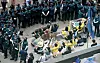 A group of college students stage a sit-in protest, tying their bodies with the Statue of Peace, to protect the symbol of victims of sexual slavery by the imperial Japanese military during World War II, near the Japanese Embassy in Seoul on Tuesday. Another group also staged a rally demanding the removal of the statue. [YONHAP]
