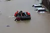 Firefighters rescue workers who were stranded inside a factory in Paju, Gyeonggi, due to heavy rain on Thursday morning. [YONHAP]
