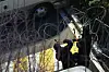 Police cut through the wires at the entrance of the presidential compound in Yongsan District, central Seoul, on Jan. 15. [NEWS1]