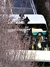 Police put up a ladder to scale a bus barricade at the entrance of the presidential compound in Yongsan District, central Seoul, on Jan. 15. [YONHAP]