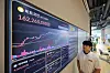 The price of Bitcoin is displayed on a status board at the Bithumb Lounge Gangnam main branch in Seocho District, southern Seoul, with one Bitcoin priced at 162.2 million won ($117,430) on July 14. Bitcoin prices hit an all-time high on a Korean cryptocurrency exchange on the same day, in line with global rallies fueled by optimism over long-awaited policy support for the industry.[YONHAP]