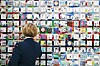 A UN Command staff member looks at paintings dedicated to commemorating Korean War veterans, on display at the War Memorial of Korea in Seoul on Thursday. The memorial collected paintings drawn by children from 20 combatant nations and put them on exhibition to mark the 70th anniversary of the Korean War's outbreak. [NEWS1]