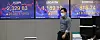 An employee stands in front of a screen showing the final Kospi figure at a Hana Bank dealing room in Jung District, central Seoul, on Monday. The benchmark Kospi on Monday rose 25.24 points, or 1.1 percent, to close at 2,329.83, while the Kosdaq added 19.73 points, or 2.48 percent, to close at 815.74. [YONHAP]
