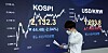 Employee looks at the screen in the dealing room of KB Kookmin Bank, in the financial district of Yeouido, western Seoul, Friday. [YONHAP]