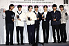 BTS members pose in front of cameras after being appointed as ambassadors for Busan’s bid to host the 2030 World Expo last Tuesday at their agency HYBE in Yongsan District, central Seoul. [YONHAP]