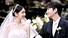 Kim Yuna, left, looks at her groom Ko Woo-rim during their wedding on Oct. 22 last year. [SCREEN CAPTURE]