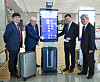 Incheon International Airport Corporation CEO Koo Bon-hwan and other delegates pose next to the country’s first smart scale installed Terminal 2 on Wednesday. The automated system not weighs luggage but it then send users updates on the progress of luggae as it is being loaded via an app. [YONHAP]
