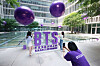 Employees of Amore Pacific visit a photo booth set up in an event zone celebrating the 10th anniversary of BTS's debut at the cosmetic companies' headquarters in Yongsan District, central Seoul, on Wednesday. The event zone, which runs in collaboration with the '2023 BTS Festa,' will also exhibit a photo wall and limited-edition goods assembled by Amore Pacific. [YONHAP]