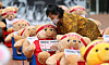 A woman from a union representing street vendors organizes teddy bears in front of Mapo District Office in western Seoul on Thursday in a protest against social distancing measures banning groups of more than 10 people. [YONHAP]