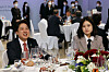 Park Ji-hyun, right, interim co-chair of the Democratic Party, is seated beside Lee Jun-seok, chairman of the People Power Party, at a banquet for U.S. President Joe Biden at the National Museum of Korea in central Seoul on May 21. [YONHAP]