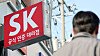 A pedestrian walks by an SK Telecom shop in Seoul on Nov. 4. [NEWS1]
