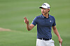 Min Woo Lee of Australia acknowledges fans after a putt on the 18th green during the second round of The American Express at Pete Dye Stadium Course on Jan. 19 in La Quinta, California. [GETTY IMAGES]