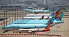 Korean Air Lines and Asiana Airlines carriers stand idle at Incheon International Airport last month. [YONHAP]
