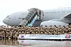 Service members of the 17th batch of Korea’s Akh Unit gather at Incheon International Airport Tuesday before heading to the United Arab Emirates aboard the KC-330 aerial tanker. The aircraft is scheduled to bring home the 16th batch of the unit on its way back to Korea later this week. It’s the first time for the KC-330 to carry out the troop transport mission since it was put into service last year. [YONHAP]
