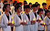 Nursing students take part in a candlelight ceremony during the 27th Nightingale Pledge ceremony at Ajou University in Suwon, Gyeonggi, on Oct. 28. [YONHAP]