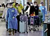 Arrivals from China are guided to PCR testing centers at Incheon International Airport on Wednesday. [YONHAP]