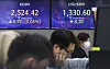 A screen in Hana Bank's trading room in central Seoul shows stock and foreign exchange markets open on Tuesday. [YONHAP]
