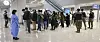 People arriving from China being tested for Covid-19 at Incheon International Airport on Monday. [YONHAP]