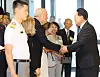 President Yoon Suk Yeol, right, shakes hands with John Linton, director of International Health Care Center of Severance Hospital, whose father fought in the Korean War, at a special exhibition dedicated to the 70th anniversary of Korea-U.S. alliance at the National Museum of Contemporary History in Seoul on Sunday. [YONHAP]