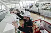 A worker covers a surveillance camera installed near an early voting site at Incheon International Airport on Thursday. Early voting for the April 10 general election will take place from 6 a.m. to 6 p.m. on Friday and Saturday across 3,565 polling stations nationwide. [JOINT PRESS CORPS]