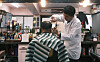 Barber Jang Jae-won cuts a customer's hair at the Mi Il Barbershop in Jongno District, central Seoul, on Wednesday. On the same day, the Seoul Metropolitan Government added the barbershop, opened in 1974 by Jang's father, to the city's Seoul Future Heritage list this year. The city government has maintained the list since 2013 to preserve the city's historic heritage. The Korea House, a cultural venue in downtown Seoul that offers traditional wedding ceremonies and cultural events, was the other place added to the list this year. [YONHAP]