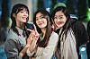 From left, actors Jeong Eun-ji, Lee Sun-bin and Han Seon-hwa pose for photo during the filming of Tving original series ″Work Later, Drink Now.″ [TVING]